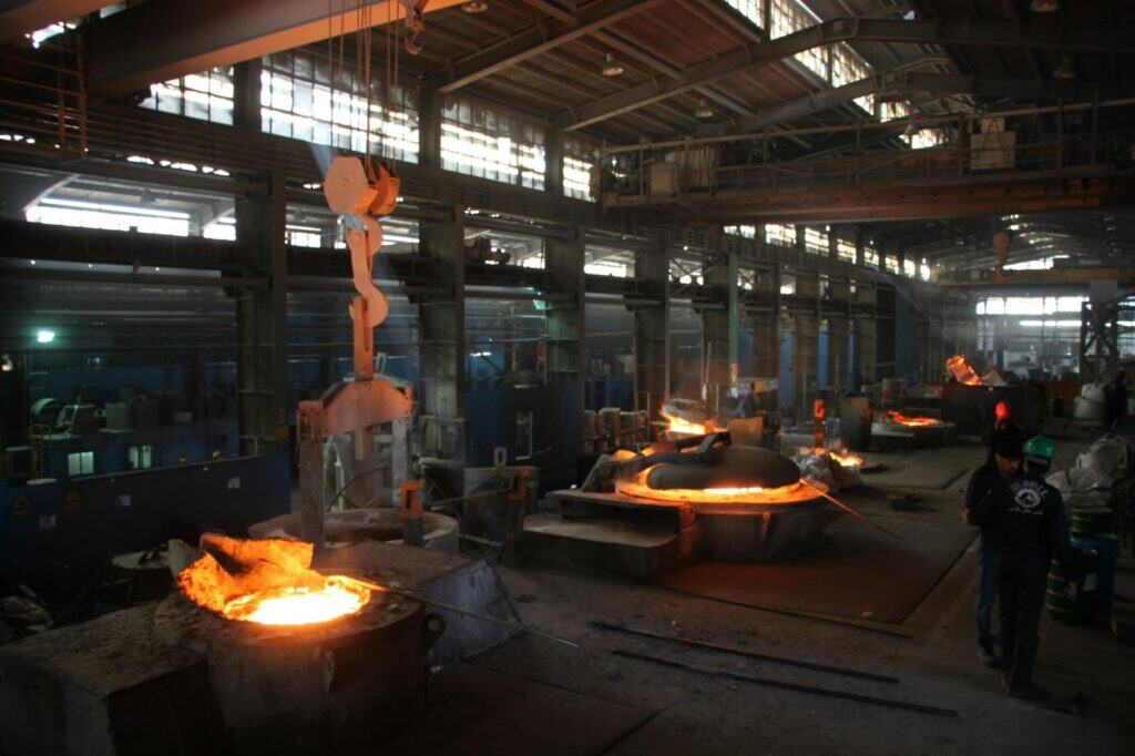 Industrial foundry with molten metal used for heat resistant steel casting